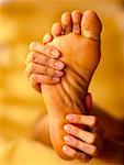 Hands Massaging Foot