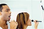 Couple Getting Ready in Bathroom