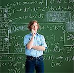 Portrait of Man Standing in Front of a Chalkboard