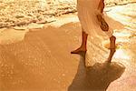 Woman Walking along Beach