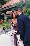 Couple in Formal Wear, Woman Holding Gift