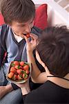 Woman Giving Man Strawberry