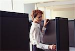 Woman with Headset in Cubicle