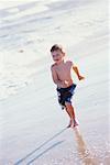 Boy Running on Beach