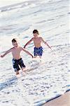 Brothers Running on Beach
