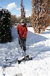 Boy Shovelling Snow