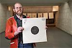 Man Holding Taget at Firing Range