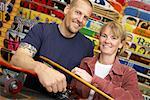 Couple with Skateboards in Store