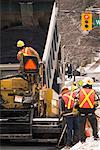 Road Workers Paving Street