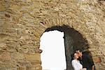 Couple in Archway Castiglione della Pescaia, Tuscany, Italy