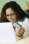 Woman with Credit Card and Laptop Computer