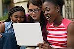 Teenagers Using Laptop Computer