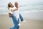 Man Giving Woman Piggy Back Ride