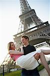 Couple by Eiffel Tower, Paris, France