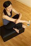 Woman Relaxing with a Bottle of Water