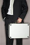 Businessman Handcuffed to Briefcase