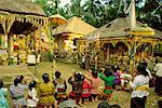 Young Women Kneeling On The Street, Bali, Indonesia