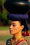 Woman Balancing Vase on Head,