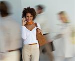 Portrait of Businesswoman with Blurred Business People