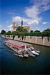 Tour Boat on The Seine, Notre Dame Cathedral in Background, Paris, France
