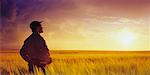 Farmer Looking at Field, Three Hills, Alberta, Canada