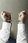 Businessman's Hands Handcuffed