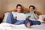 Male Couple Home Shopping