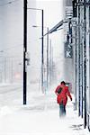 Woman Walking in Snow Storm, Toronto, Ontario, Canada