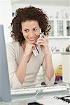 Woman with Cordless Phone and Credit Card