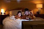 Couple Watching Television in Bed