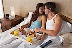 Couple Eating Breakfast in Bed