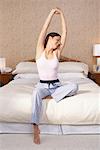 Woman Stretching in Bed