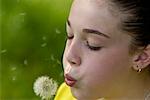 Girl Blowing Dandelion