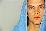 Portrait of A Young Man Fresh From Shower With Towel On Head