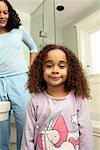 Girl with Mother in Bathroom