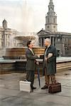 Businessmen Shaking Hands, Trafalgar Square, London, England