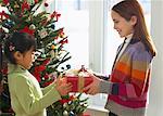 Girls Exchanging Christmas Gifts