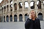 Woman with Cellular Phone by Colosseum, Rome, Italy