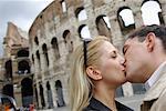 Couple Kissing by Colosseum, Rome, Italy