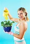 Woman Watering Plant