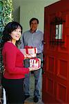 Man and Woman at Door with Gifts