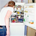 Man looking in refrigerator