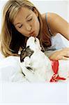 Lady owner kissing dog