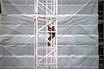 Worker on crane at site