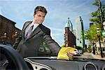 Businessman Looking at Parking Tickets