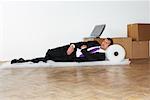 Businessman Sleeping on Bubble Wrap