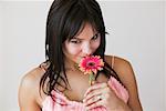 Portrait of Woman Smelling Flower