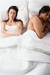 Couple Having Argument in Bed