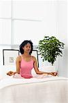 Woman Practicing Yoga in Bedroom