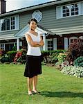 Woman in Front of House